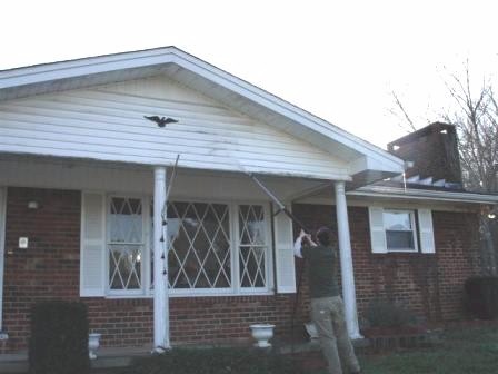 pressure washing a house